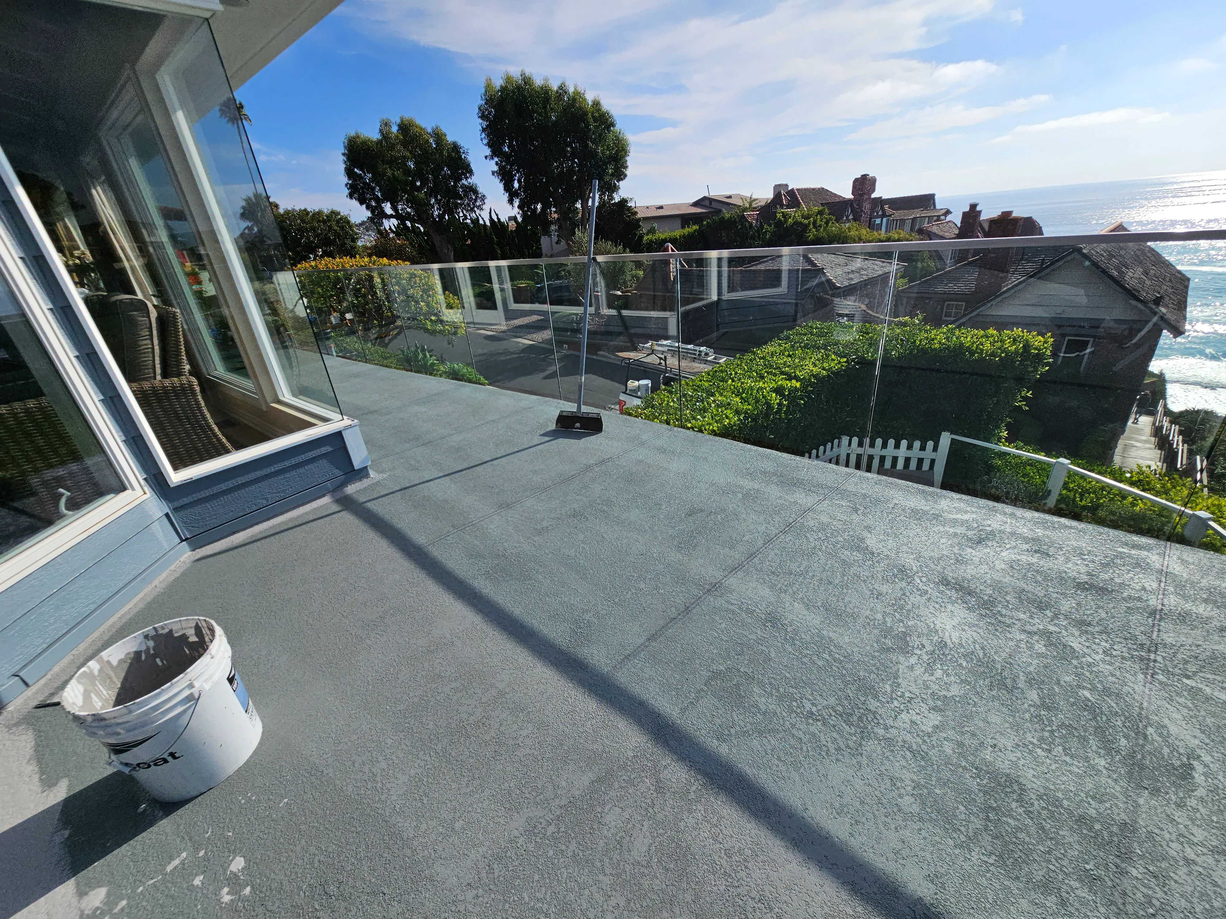 A large commercial rooftop deck in Los Angeles receiving a heavy-duty, multi-layer waterproof coating